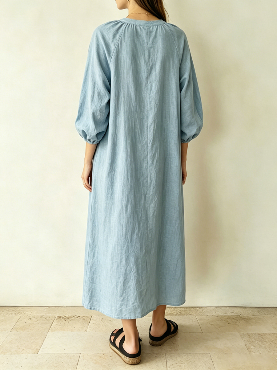Loose-fit Cotton-linen Midi Dress Featuring A Small Henley Collar, Half-button Placket, Raglan Sleeves, And Voluminous Puffed Sleeves.