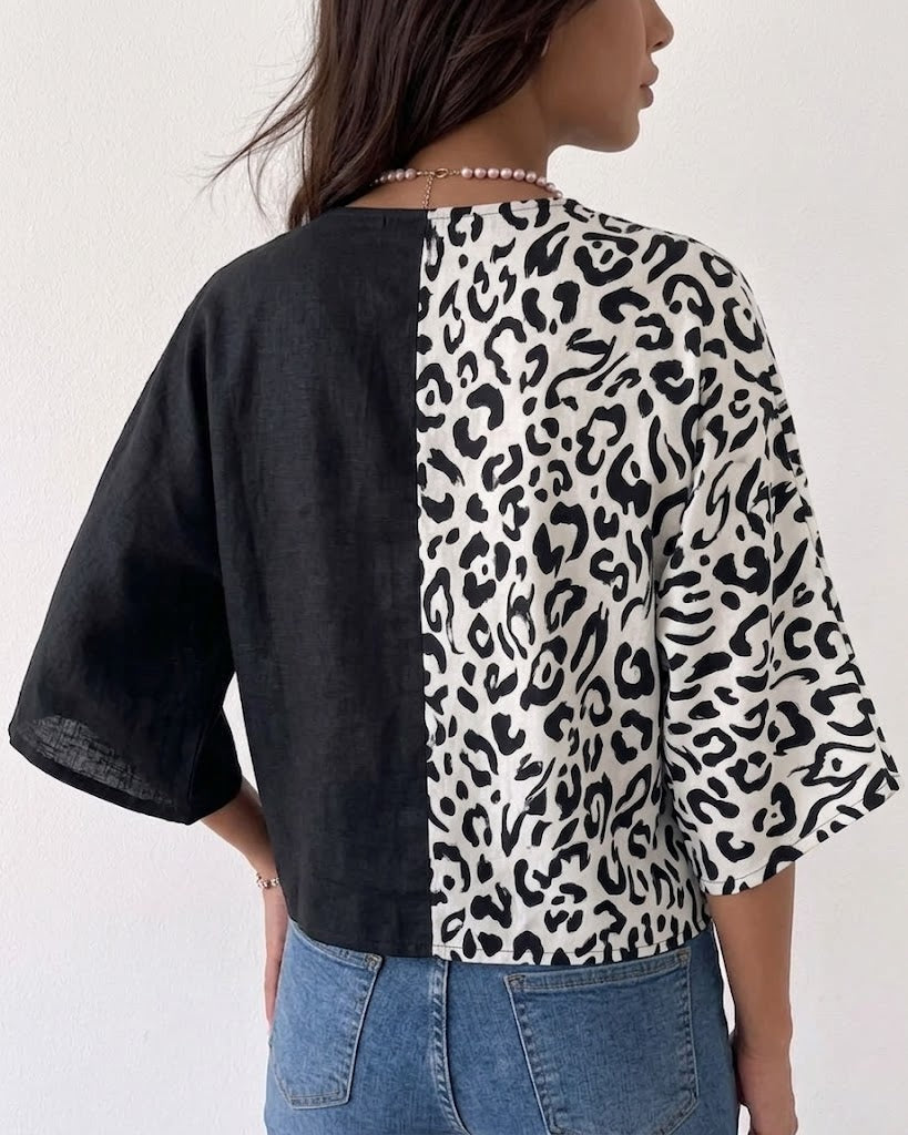 Casual-chic Linen And Cotton Top Featuring A Solid Color And Leopard Print Panel Design.