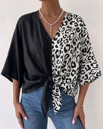 Casual-chic Linen And Cotton Top Featuring A Solid Color And Leopard Print Panel Design.