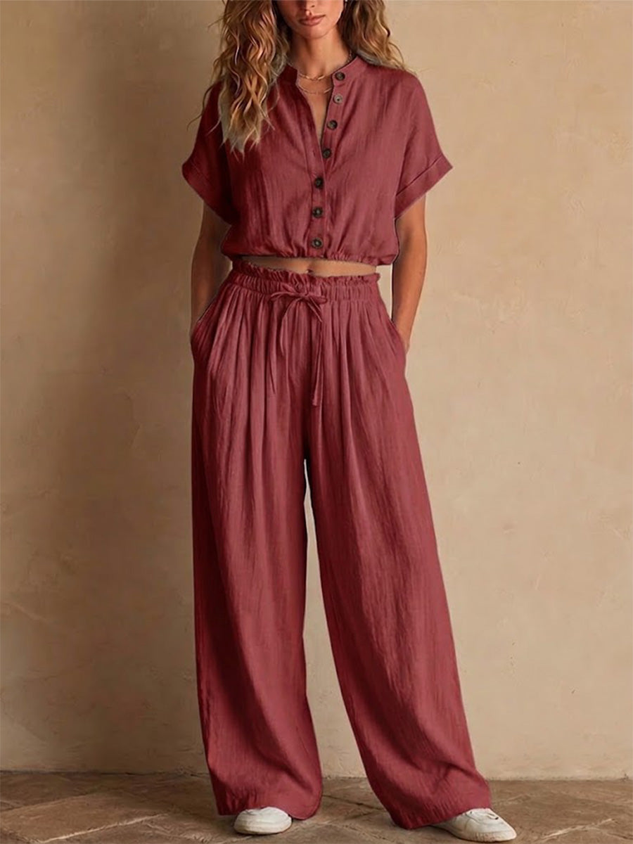 Two-piece Linen Set Featuring A Cropped, Half-button Top With A Stand Collar, Wooden Buttons, And Roll-up Sleeves, Paired With Wide-leg Trousers Featuring An Elastic Drawstring Waist