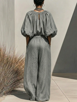 Gathered Round-neck Linen Wide-leg Jumpsuit With Lantern Sleeves And A Drawstring Waist